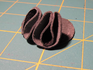 two petals glued on leather circle