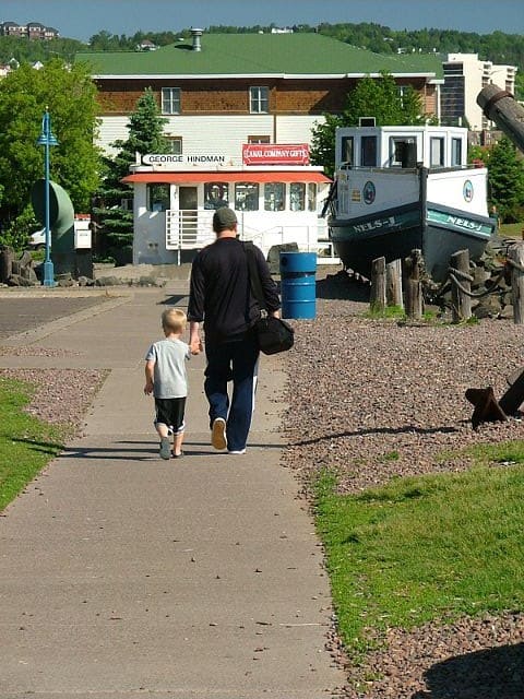 dad and son walking