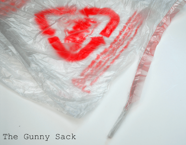 cut a plastic grocery sack