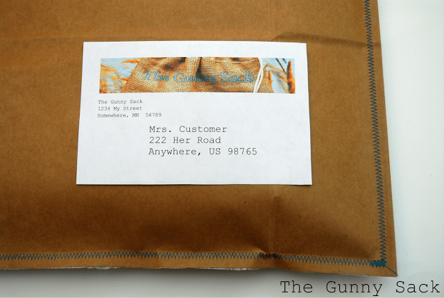 label on a brown bag envelope with blue zig-zag stitching