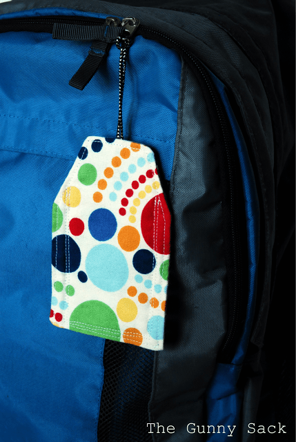 polka dot backpack tag on a blue backpack