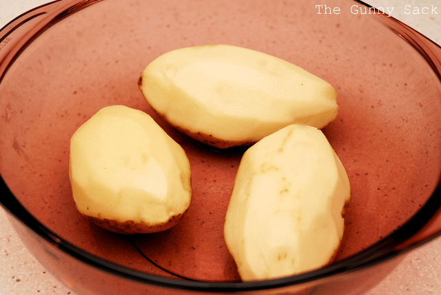 peeled potatoes in bowl