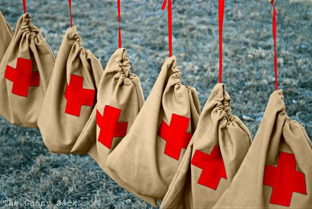 Red Cross Drawstring Bags Hanging On Line