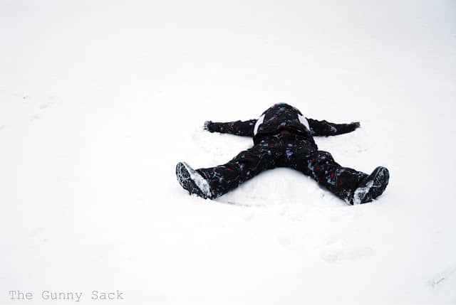 Child Making Snow Angel Negative Space In Photography