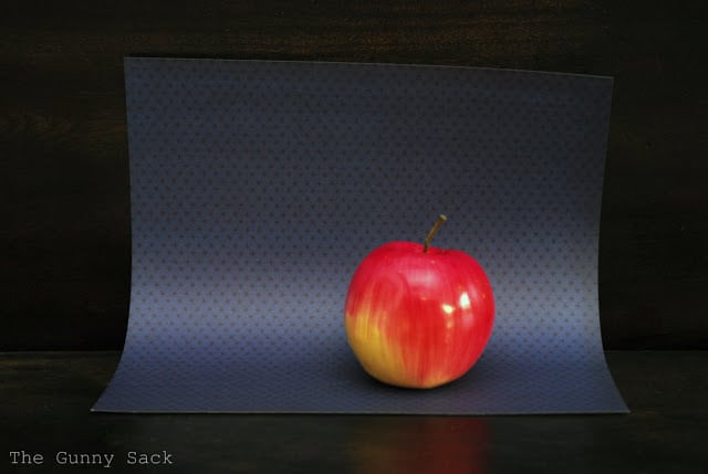 Apple On Blue Paper
