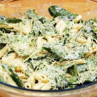spinach penne salad in bowl