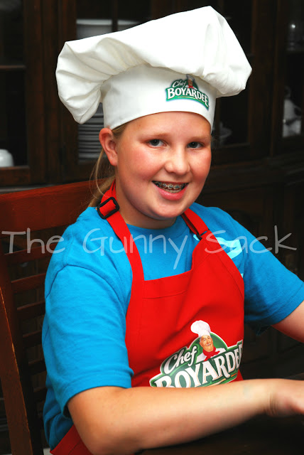 girl with chefs hat and apron