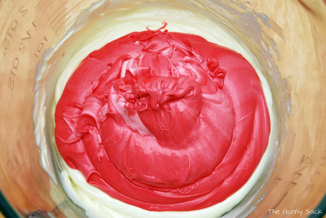 red frosting added to bowl
