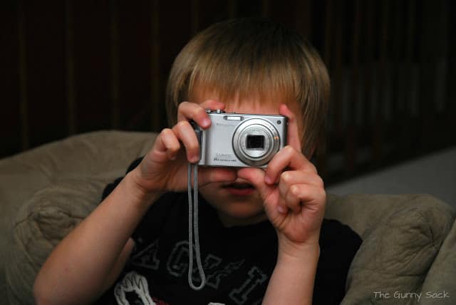 boy holding camera