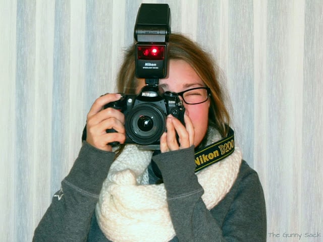 girl holding camera