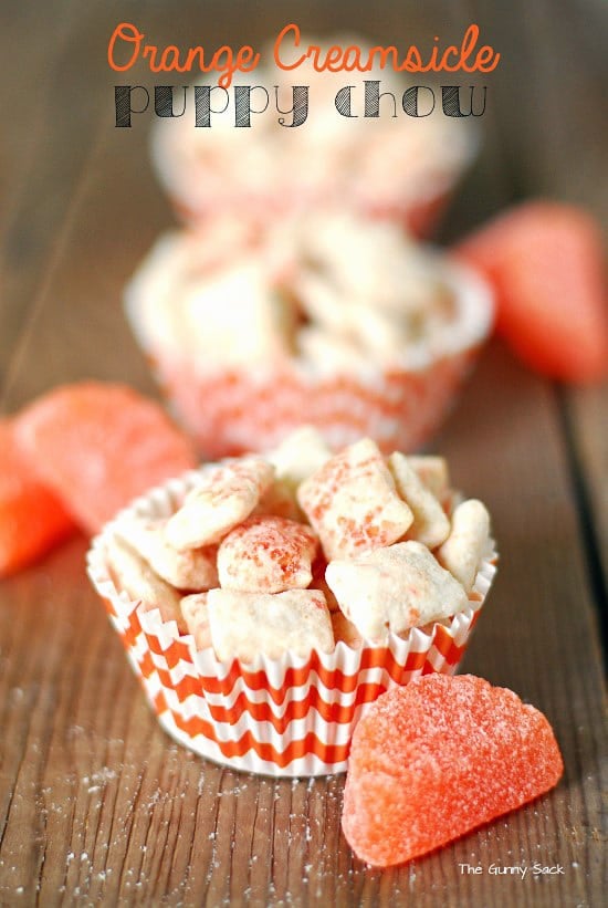 Orange Creamsicle Puppy Chow in cupcake wrappers