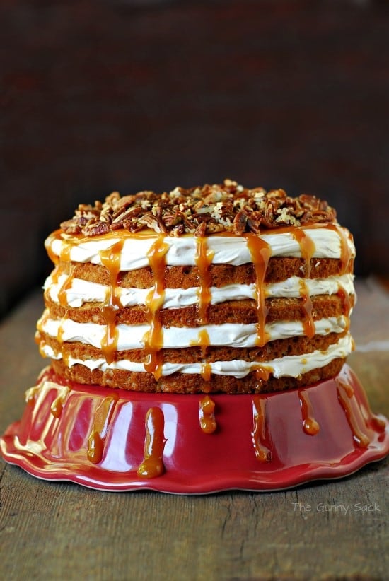 Caramel Pecan Mousse Apple Cake on red stand