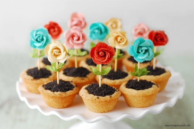 flower pot cookie cups on a white cake platter