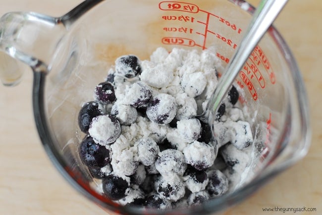 mix blueberries with flour