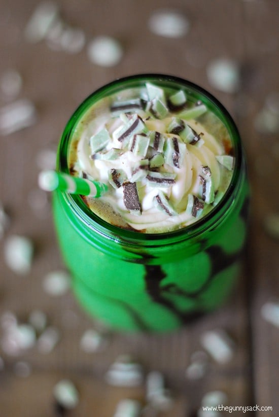 mocha mint milkshake in a green mason jar topped with whipped cream
