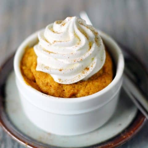 Microwave Pumpkin Cake with whipped cream on top