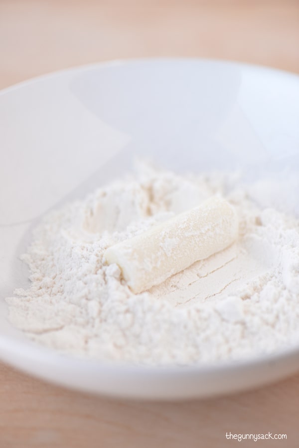 coat mozzarella sticks in flour