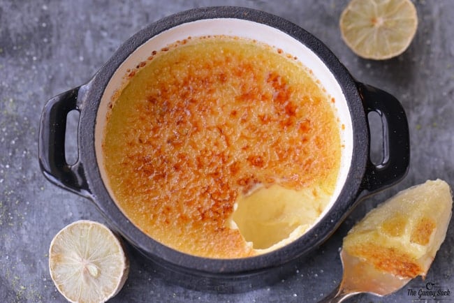 Key Lime Creme Brulee with spoonful removed