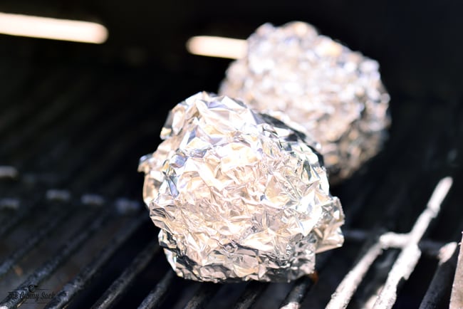 foil wrapped apples on grill