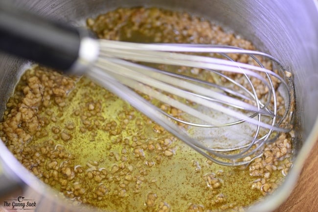 Garlic and Ginger being Whisked in Sauce Pan