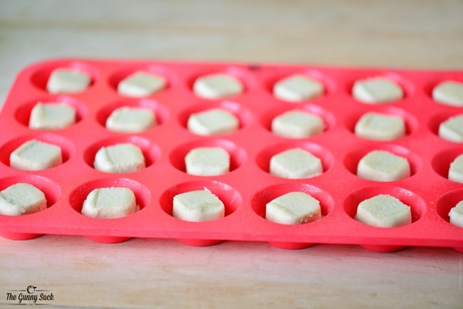 Sugar Cookie Dough In Cubes In A Silicone Mini Muffin Pan