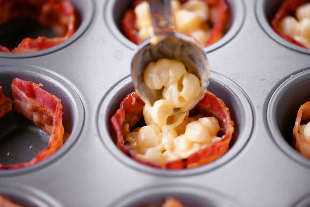 Adding The Mac And Cheese To The Muffin Tins