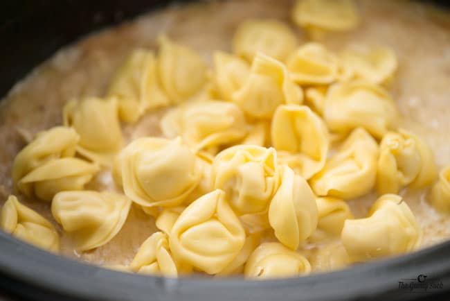 add tortellini to slow cooker