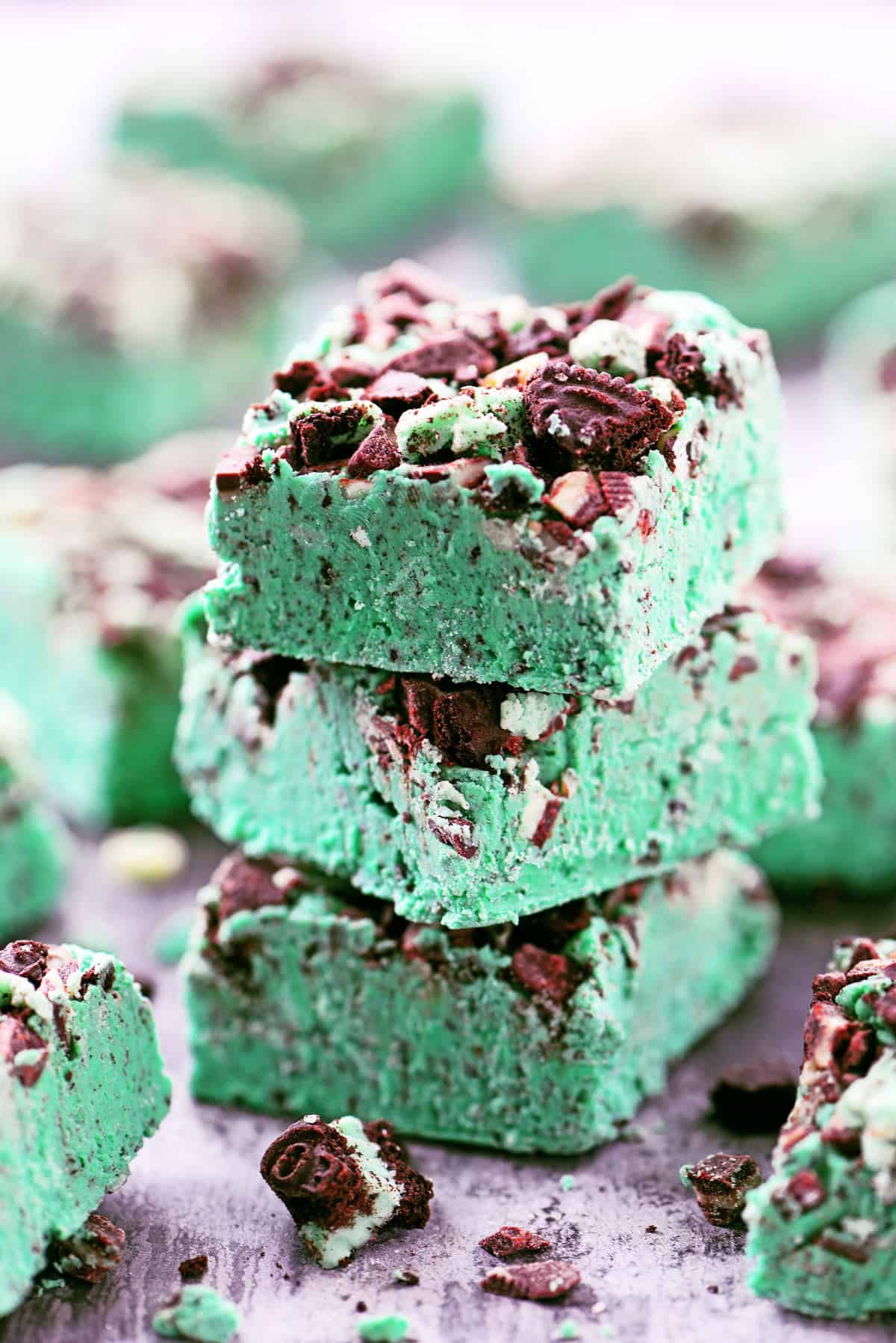 Chocolate mint fudge squares in a stack.
