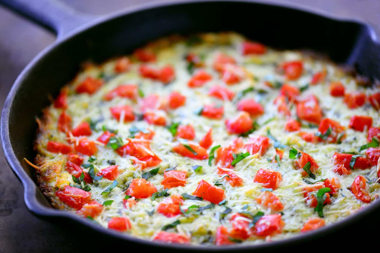 cheesy dip with tomatoes and mozzarella cheese