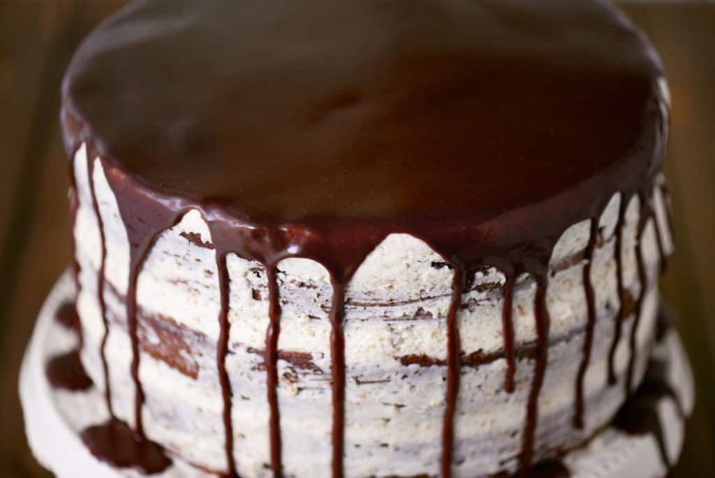 chocolate ganache drizzled over a cake