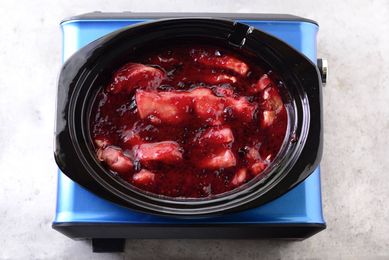 crockpot filled with ribmeat and grape jelly