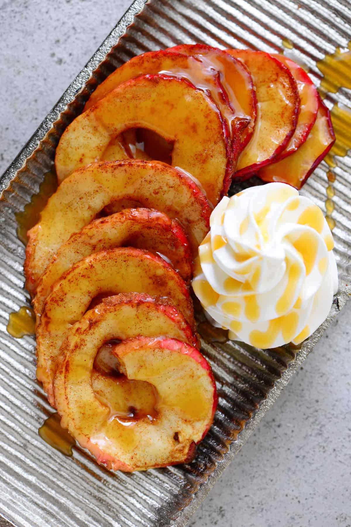 baked apple dessert drizzled with caramel