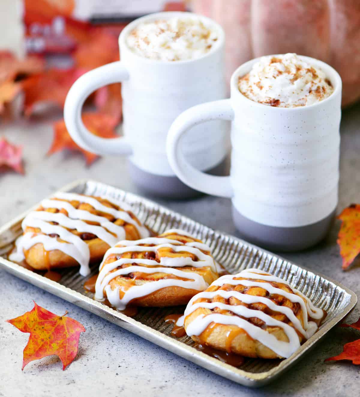 crescent roll pumpkin cinnamon rolls on tray with coffee