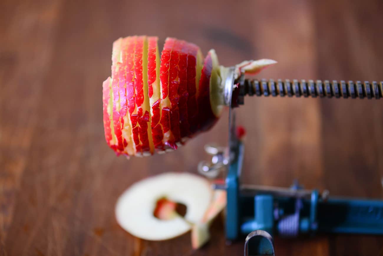 apple being cut in a spiral with core being removed 