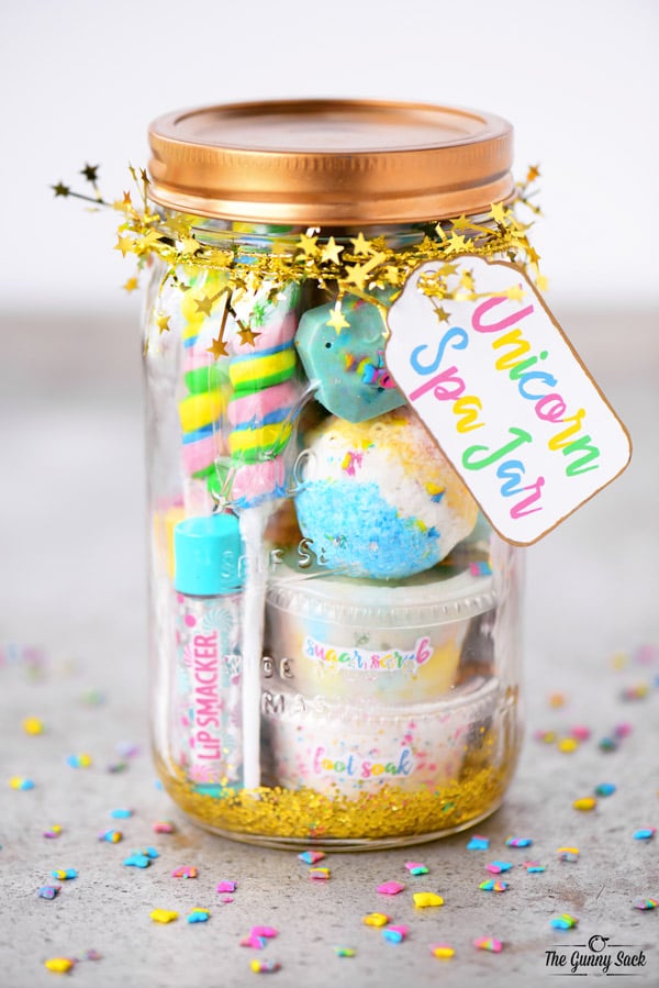 mason jar with rainbow colored spa items in it