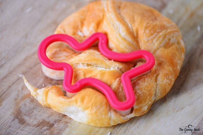croissant with a gingerbread man cookie cutter