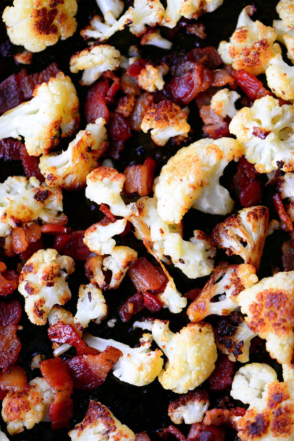 roasted bacon and cauliflower on a sheet pan