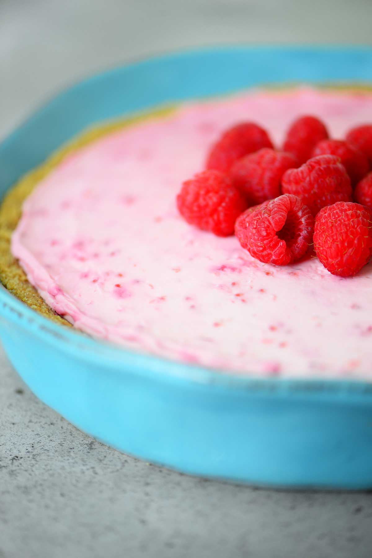 No Bake Raspberry Cheesecake in blue dish