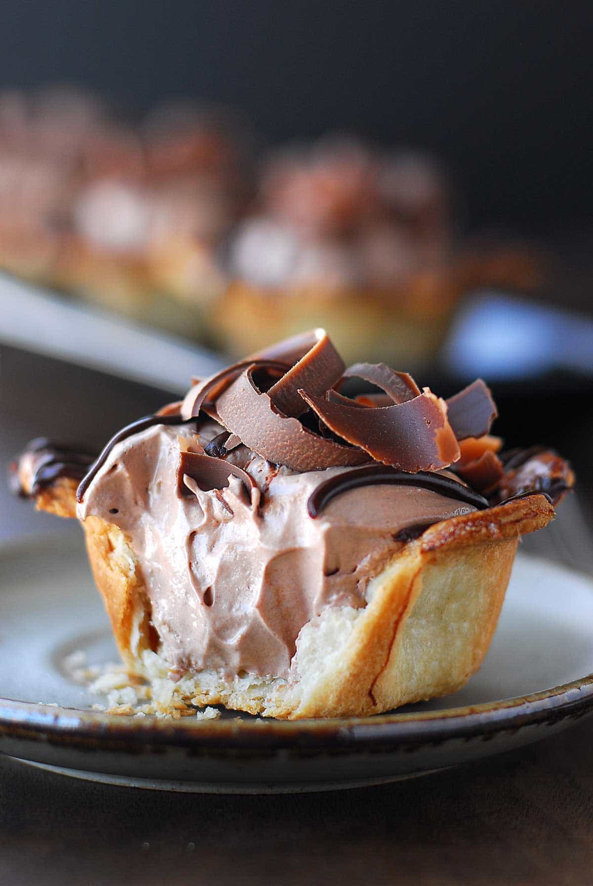 A bite off one side of the mini Nutella pie.