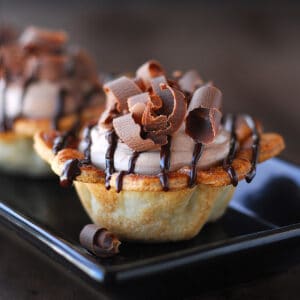 Mini Nutella pies with chocolate curls on top.