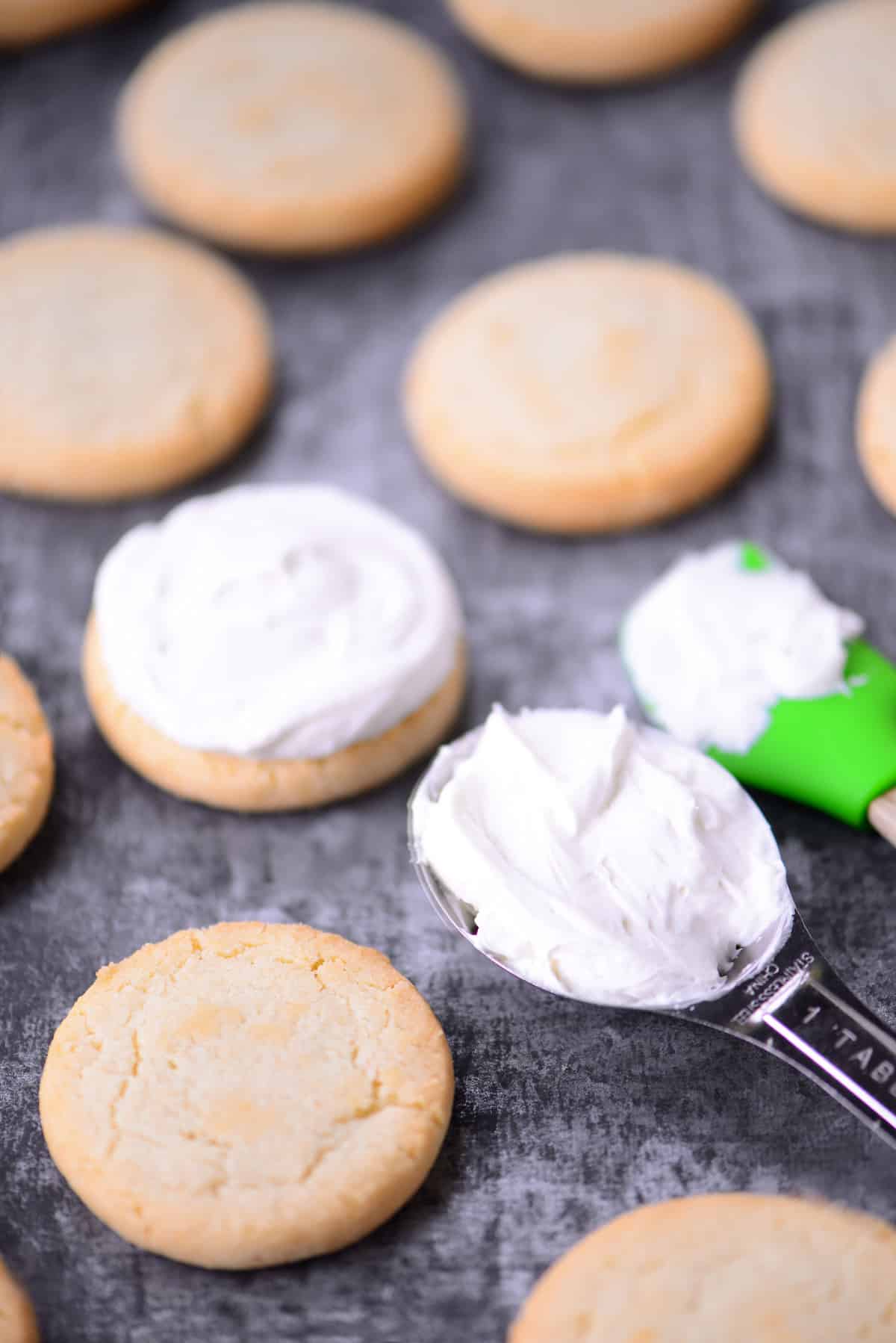 Shortbread cookies with frosting in a tablespoon.
