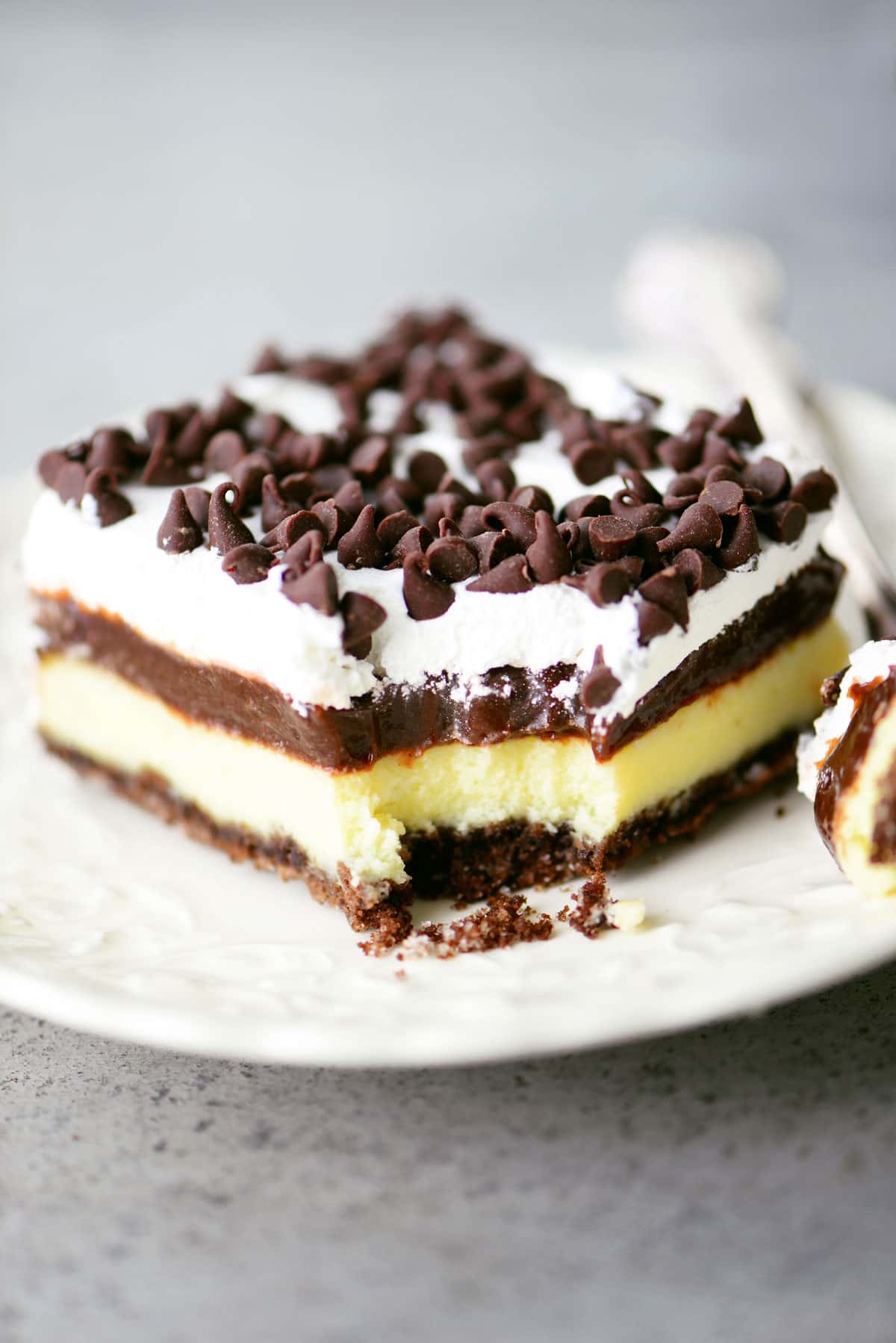 chocolate cheesecake dessert slice on white plate
