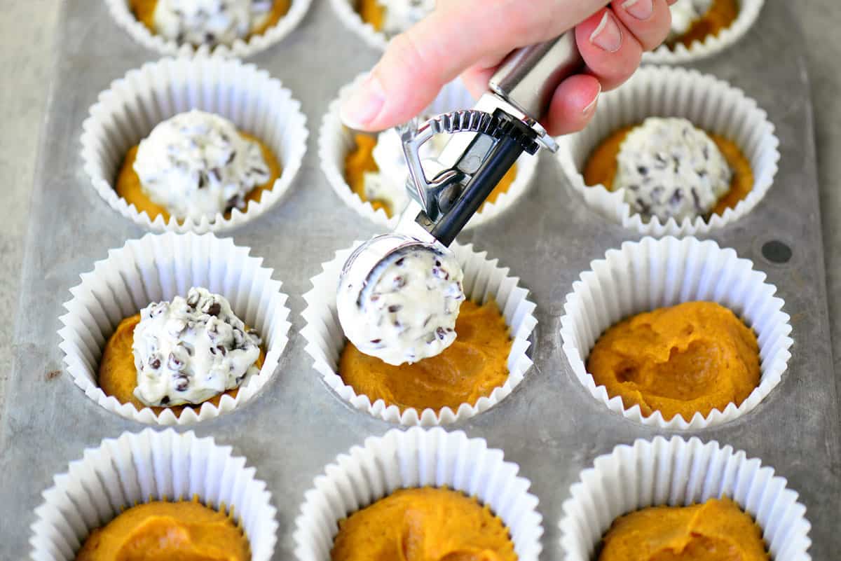 Cream Cheese Filling Scooped On Pumpkin Muffins