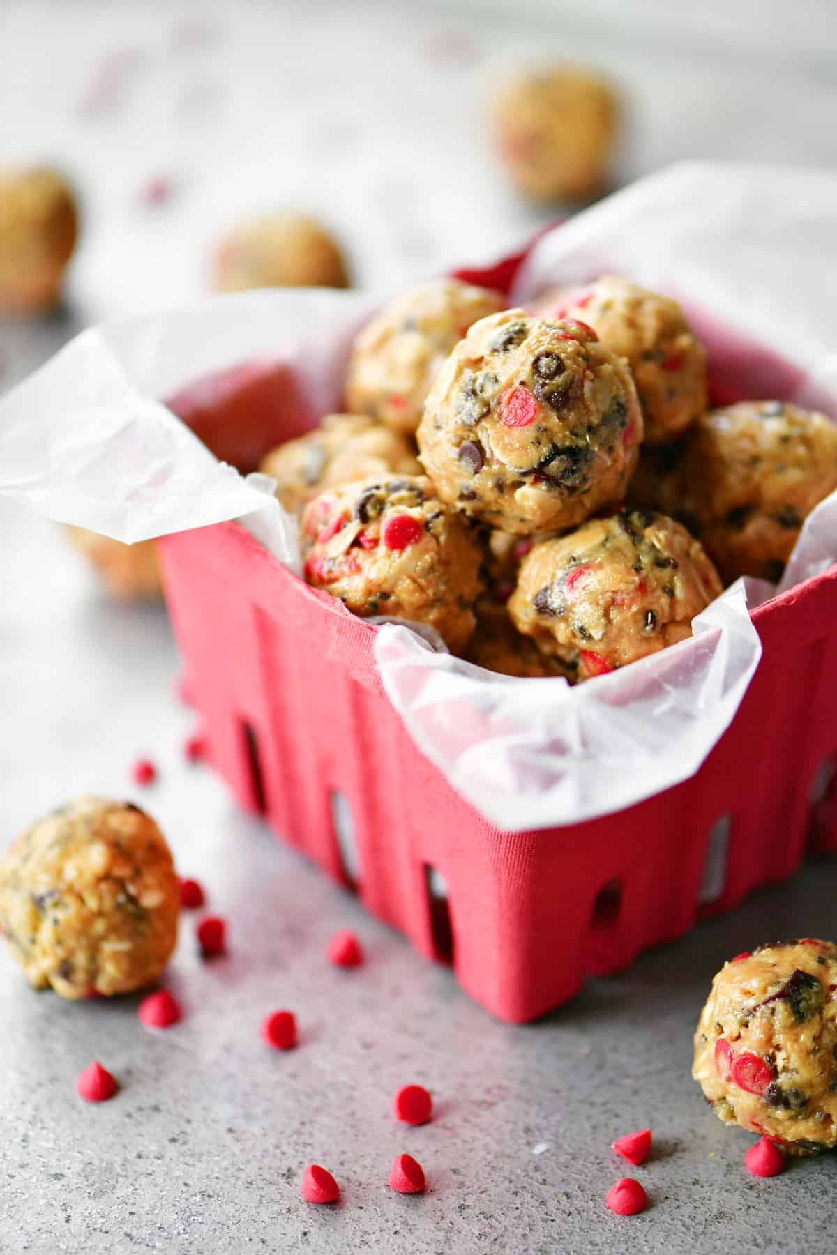 chocolate cherry energy balls protein bites in red berry basket