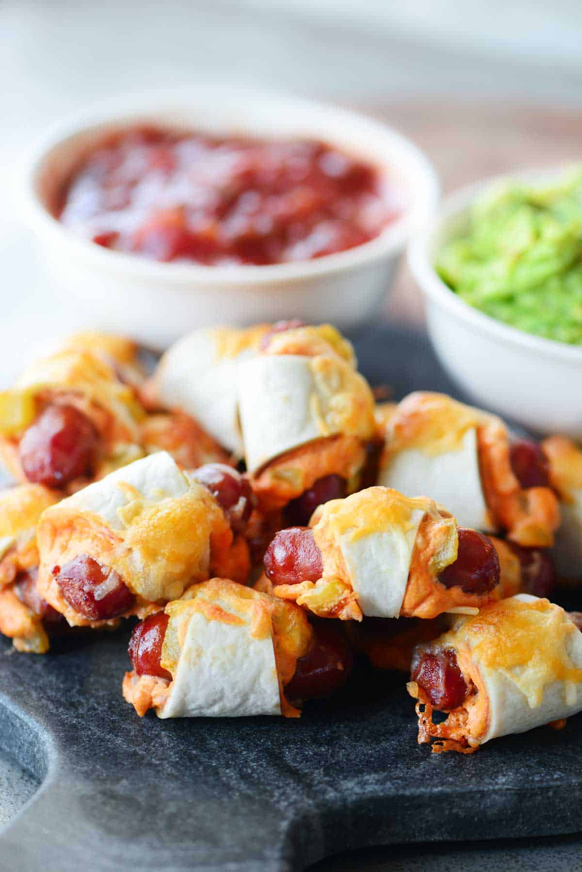Mexican Pigs In A Blanket Stacked On A Platter