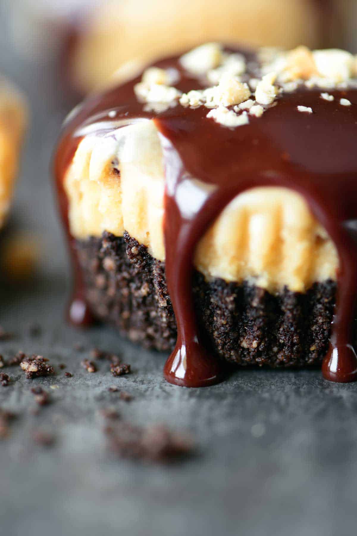 mini chocolate drizzled peanut butter cheesecakes