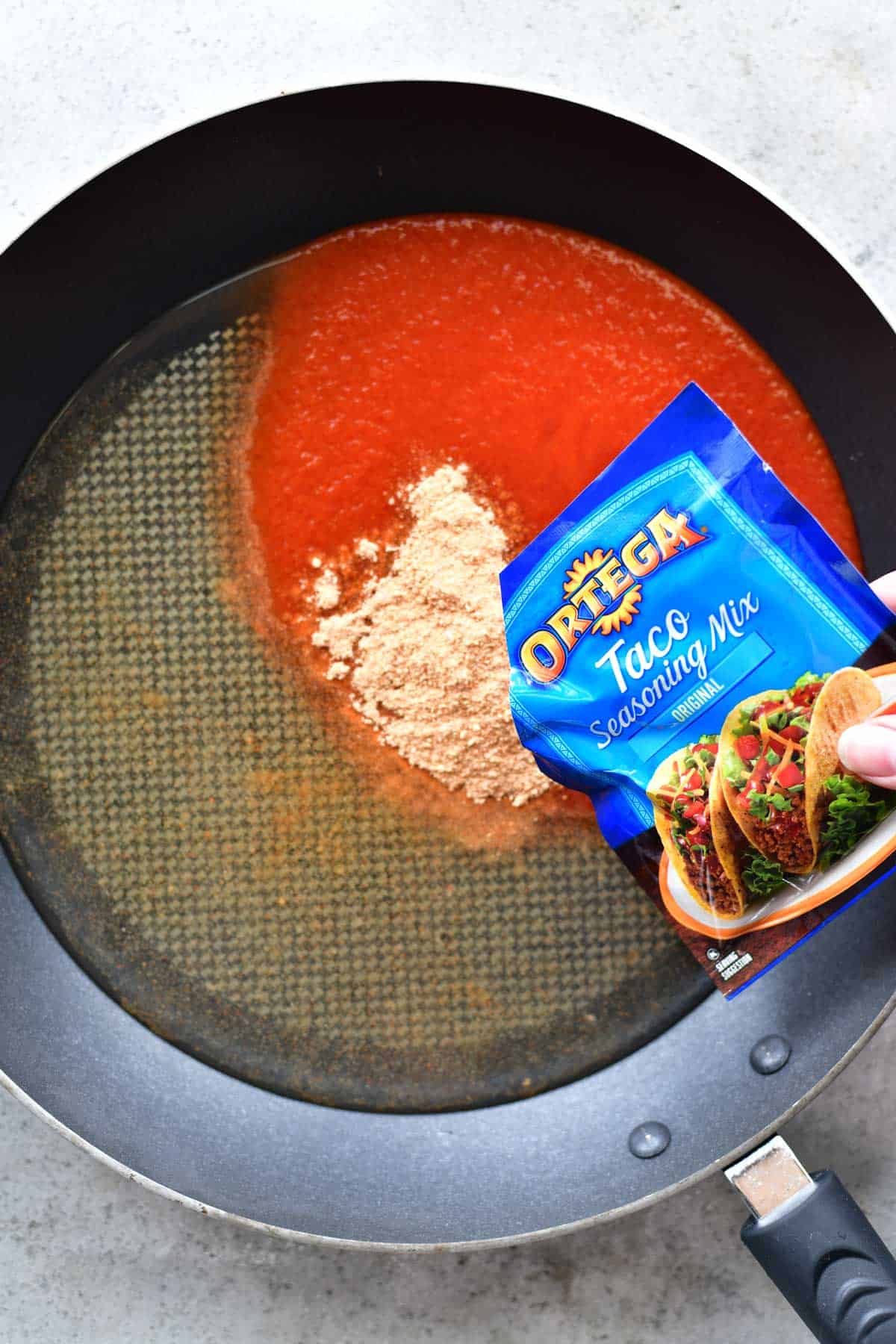 seasoning mix in pan for mini chicken taco pizzas