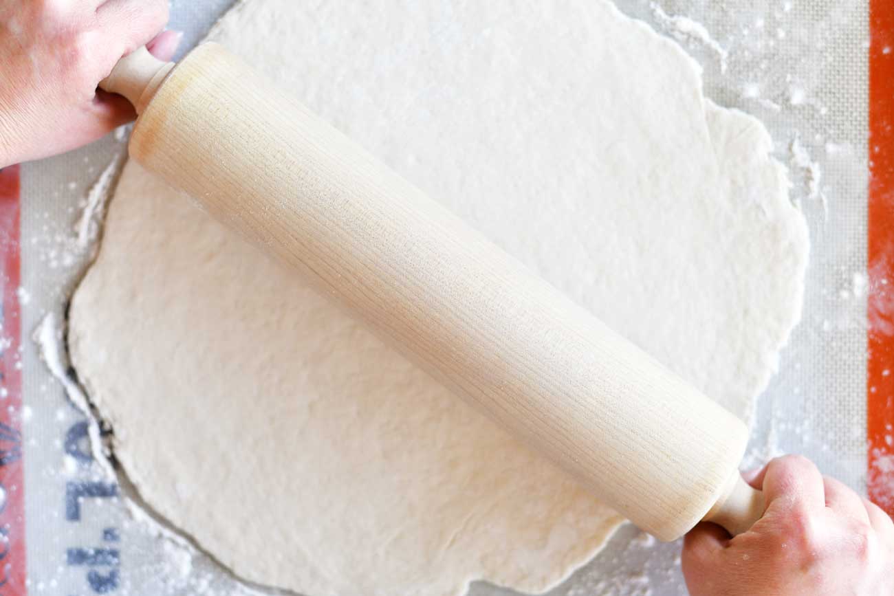 rolling out easy two ingredient pizza dough