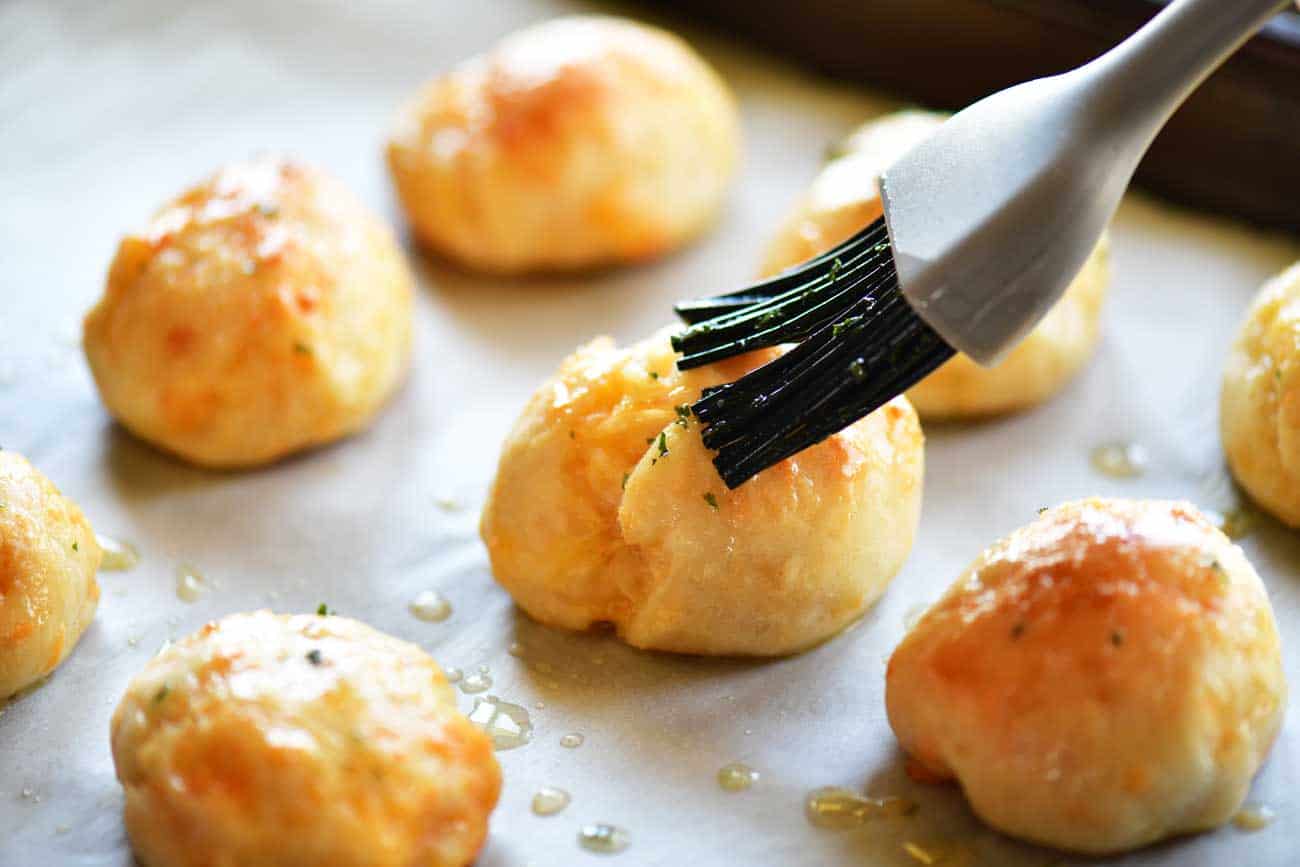 brush garlic butter on rolls