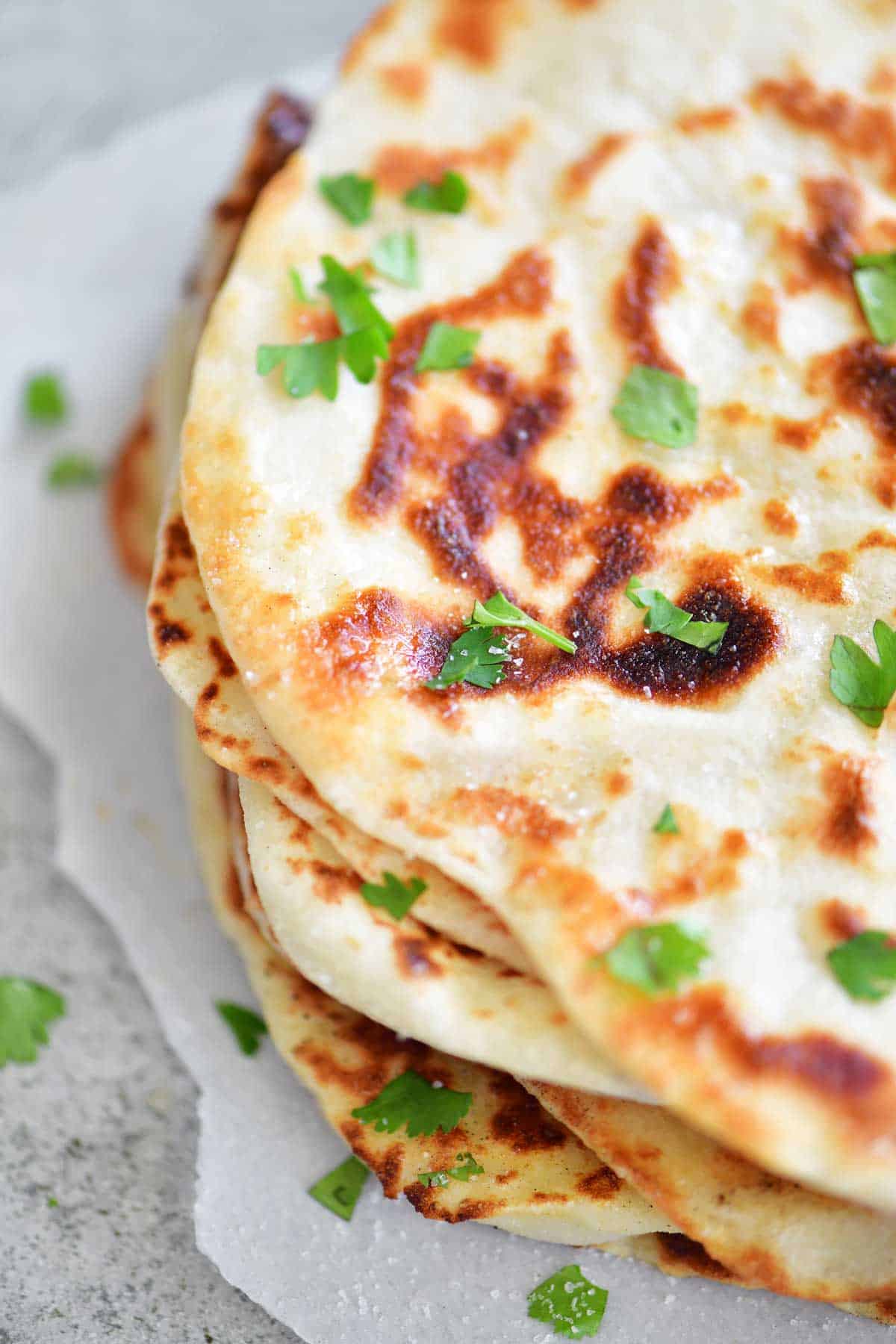 two ingredient dough naan flatbread topped with salt and chopped cilantro
